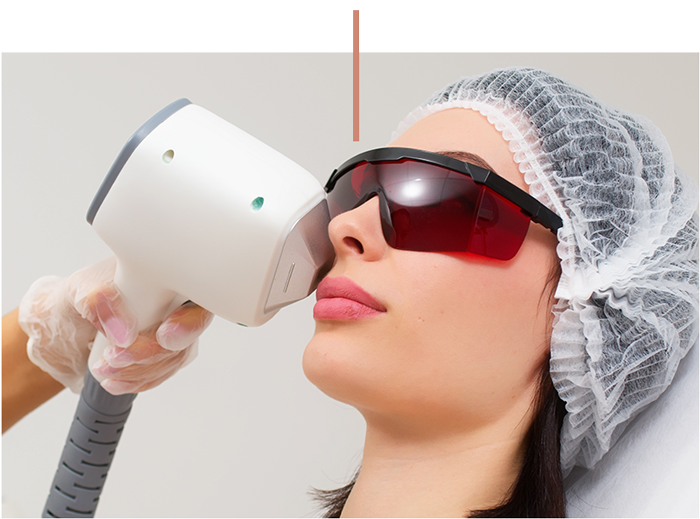 a woman wearing a hat and sunglasses